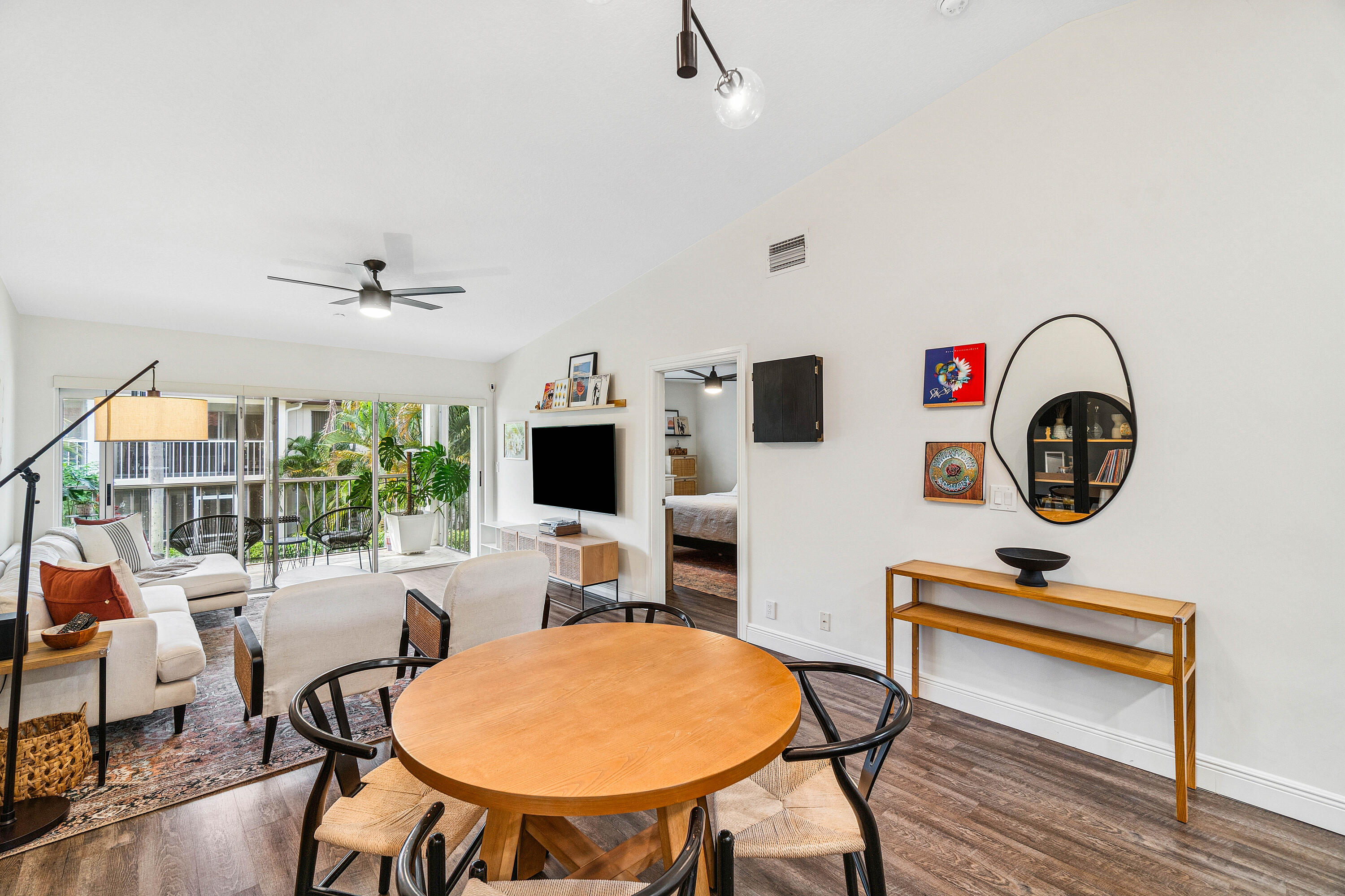 340 Northwest 67th Street, Unit 202 Boca Raton, FL 33487 - Photo 9 of 39 a work room with furniture a rug and a window
