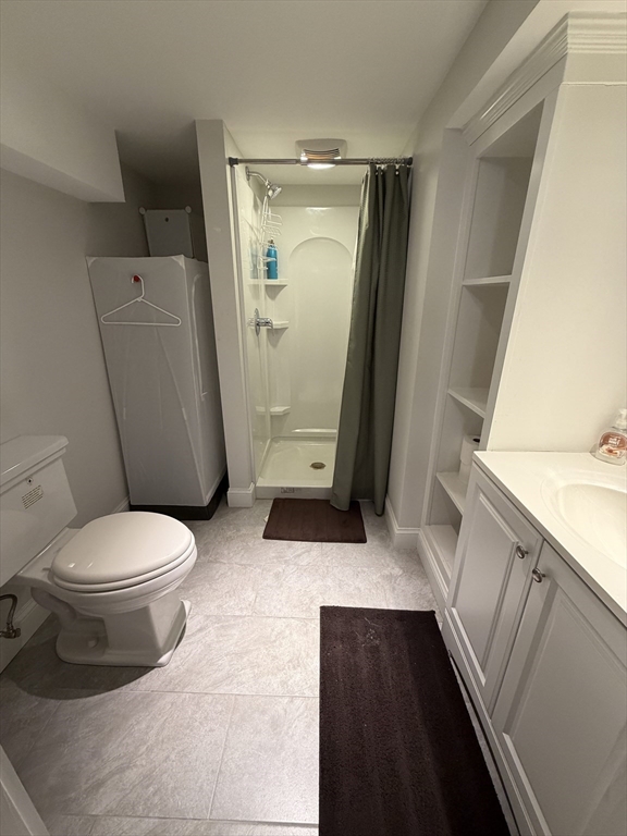 17 Cardinal Street, Unit 17 Winchester, MA 01890 - Photo 33 of 42 a bathroom with a toilet and a shower