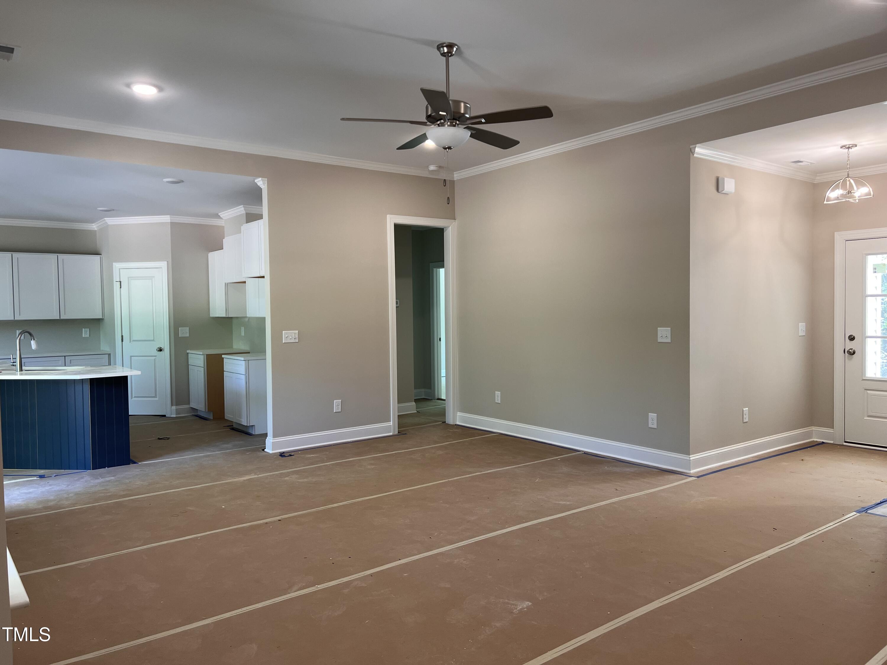 987 Lewis Road Zebulon, NC 27597 - Photo 5 of 13 a view of a kitchen with a sink and a refrigerator