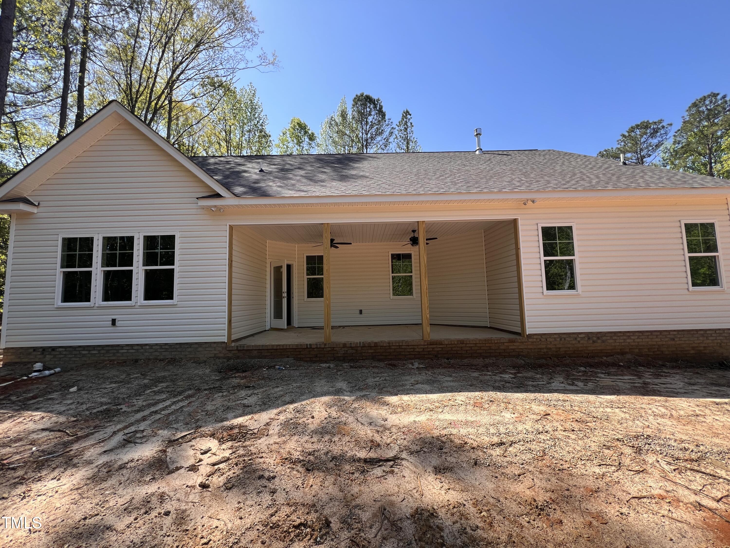 987 Lewis Road Zebulon, NC 27597 - Photo 7 of 13 a view of a house with a yard
