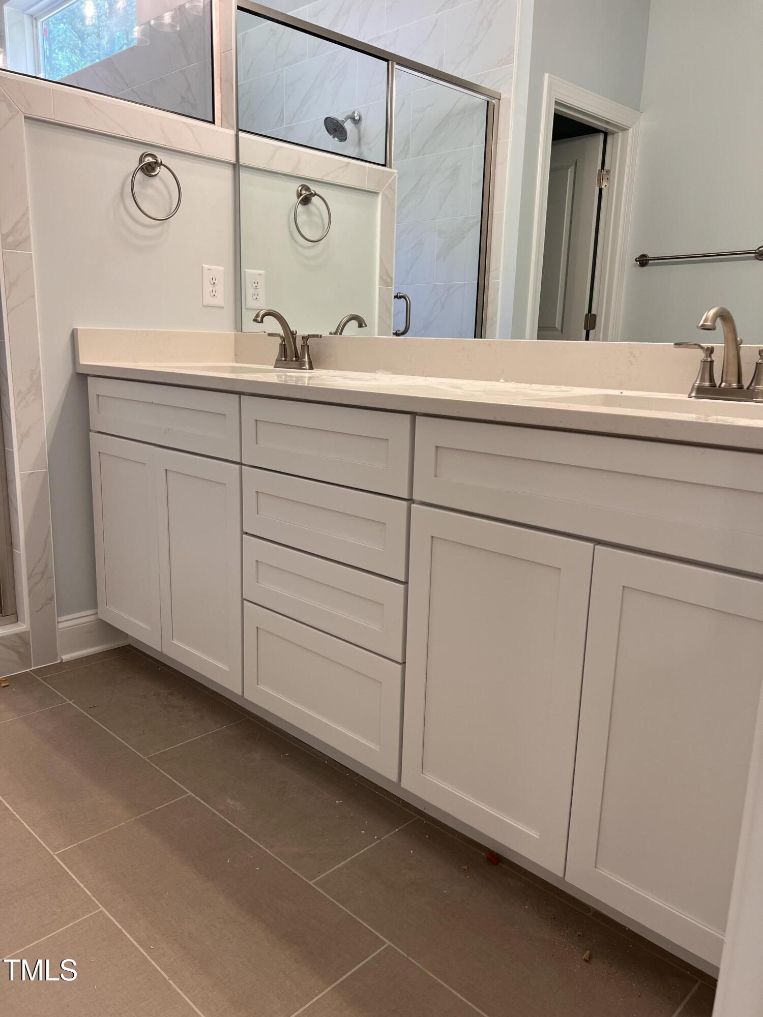 987 Lewis Road Zebulon, NC 27597 - Photo 9 of 13 a bathroom with a sink and a mirror