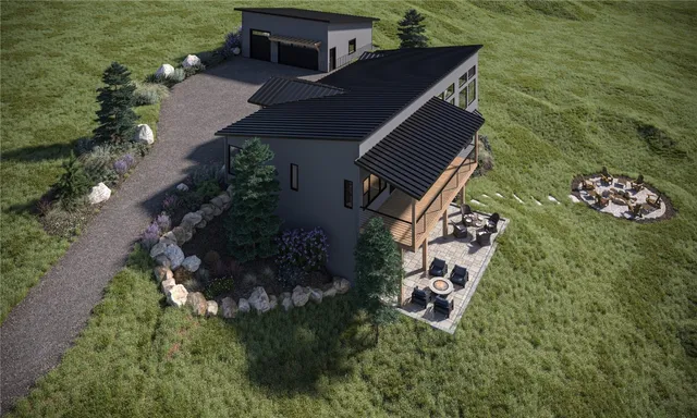 a aerial view of a house with a yard