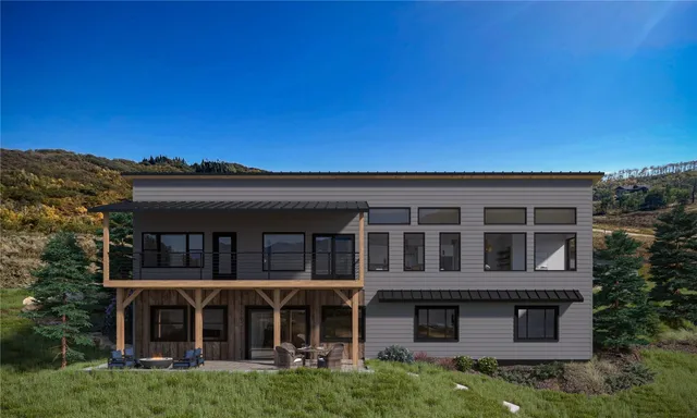 a view of a large building with a big yard and large trees