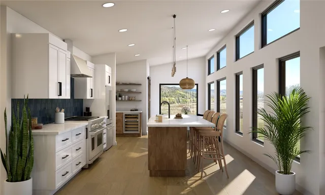 a large kitchen with stainless steel appliances kitchen island granite countertop a large center island attached withe living room