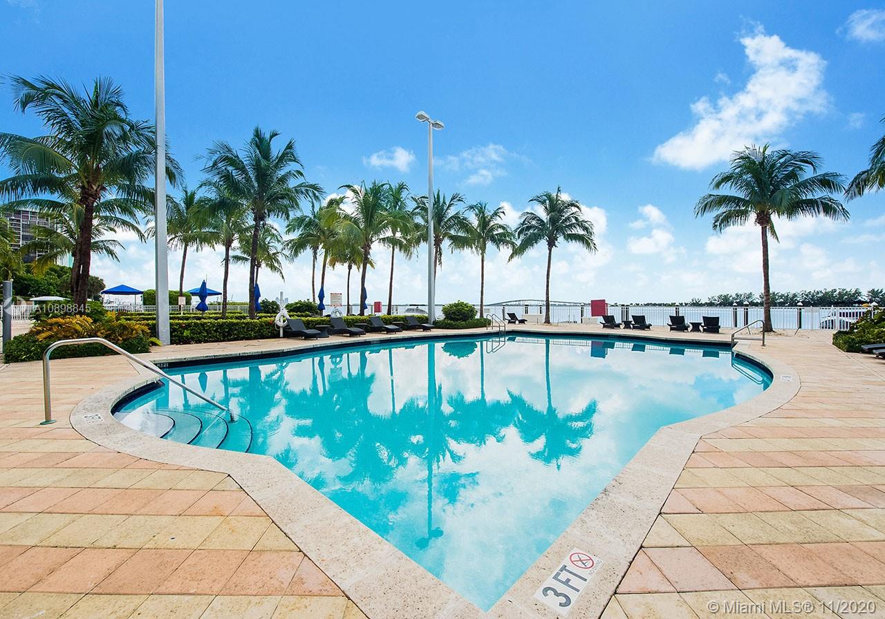 2101 Brickell Avenue, Unit 2002 Miami, FL 33129 - Photo 22 of 26 a view of swimming pool with a table and chair