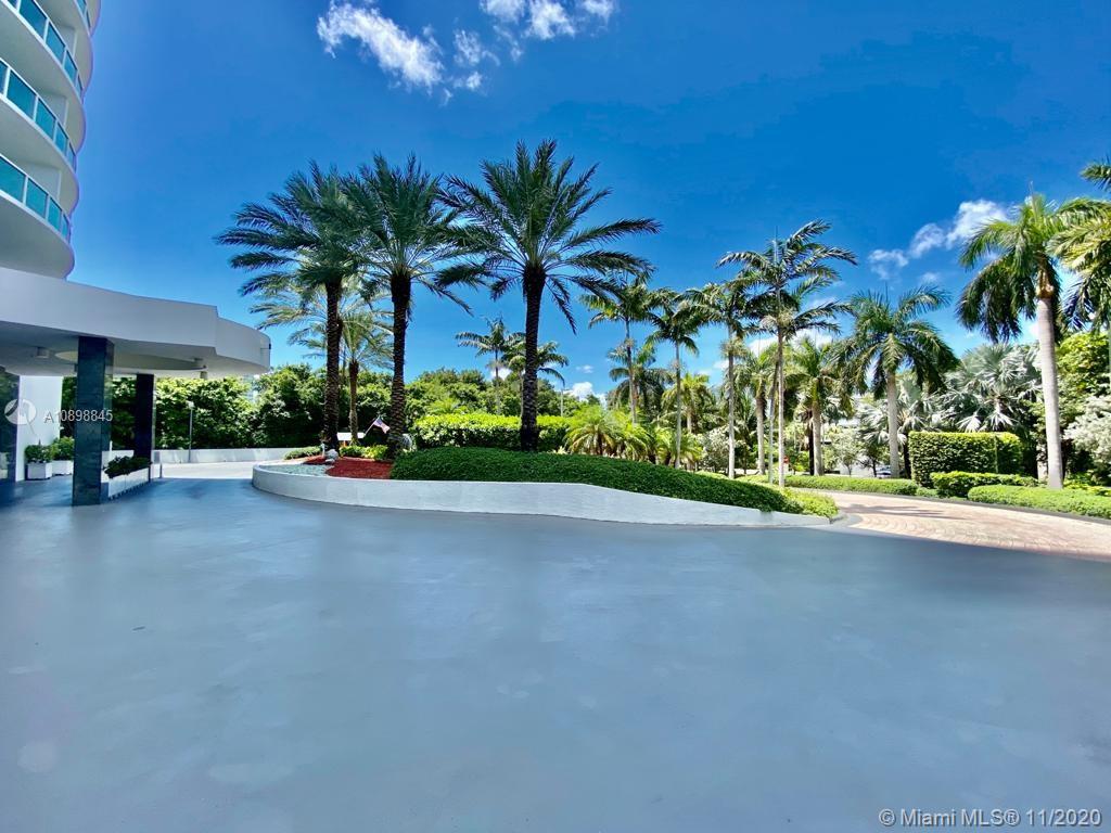 2101 Brickell Avenue, Unit 2002 Miami, FL 33129 - Photo 26 of 26 a front view of a house with a garden