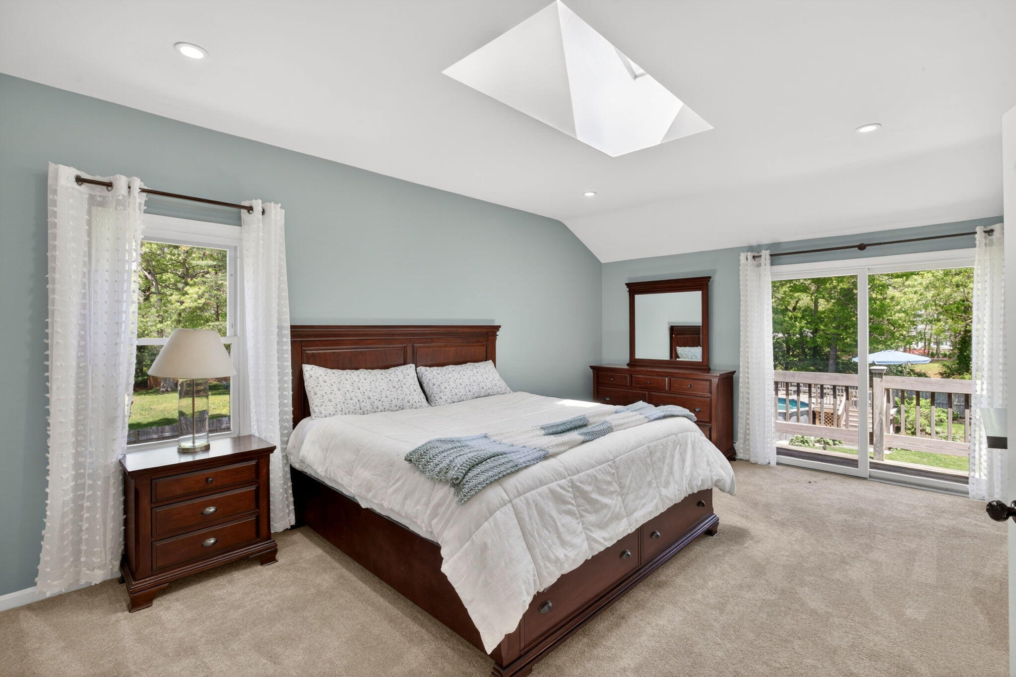 12 Sarah Lawrence Road Sandwich, MA 02563 - Photo 17 of 54 a bedroom with a bed and a large window