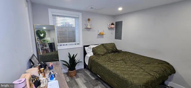 a bedroom with a bed and a window