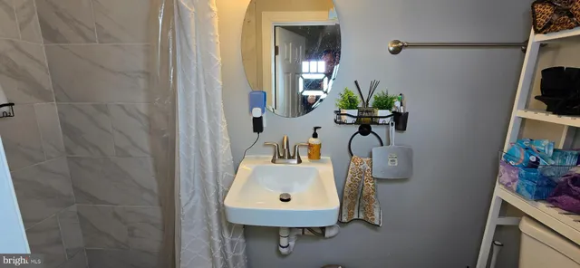 a bathroom with a sink a mirror and vanity