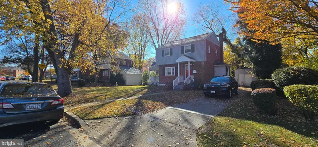 a view of a house with a yard covered in snow