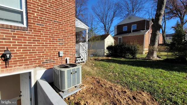 a view of a patio next to a yard