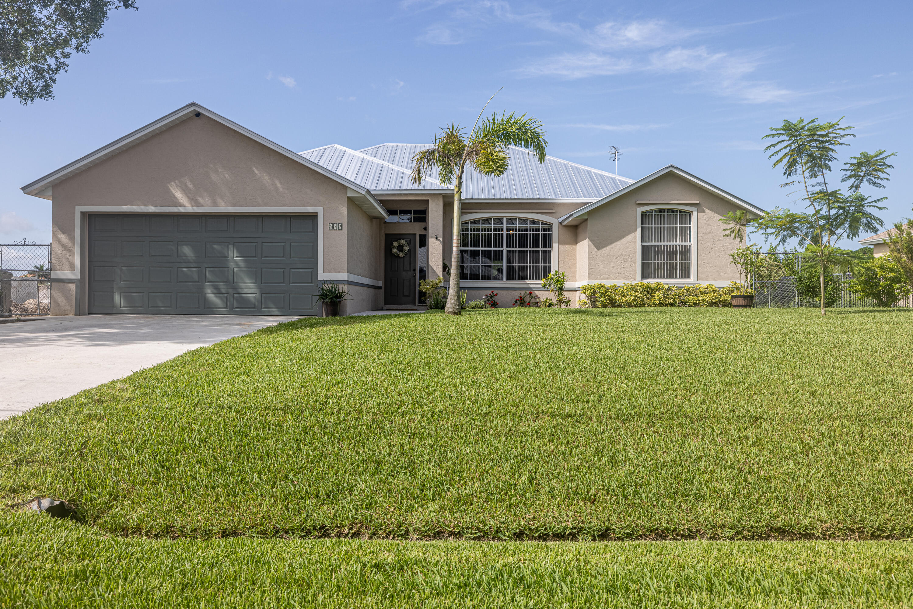 672 Southwest Aster Road Port St. Lucie, FL 34953 - Photo 3 of 43 Front