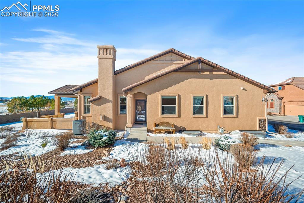 a view of a white house with a yard