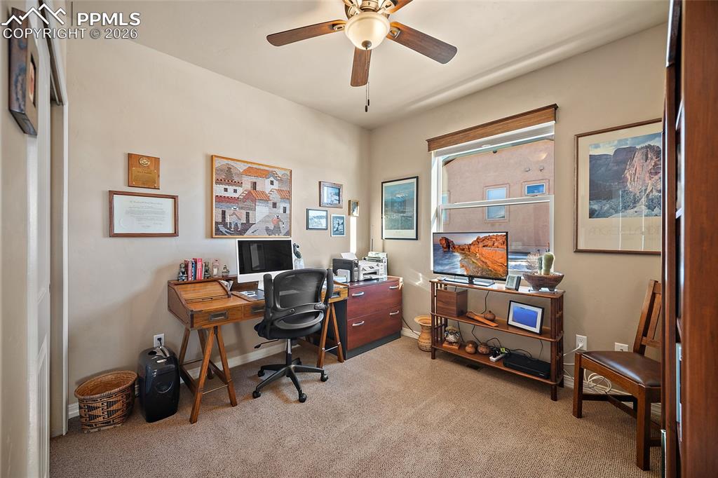 12988 Cupcake Heights Colorado Springs, CO 80921 - Photo 19 of 39 a room with furniture and a window