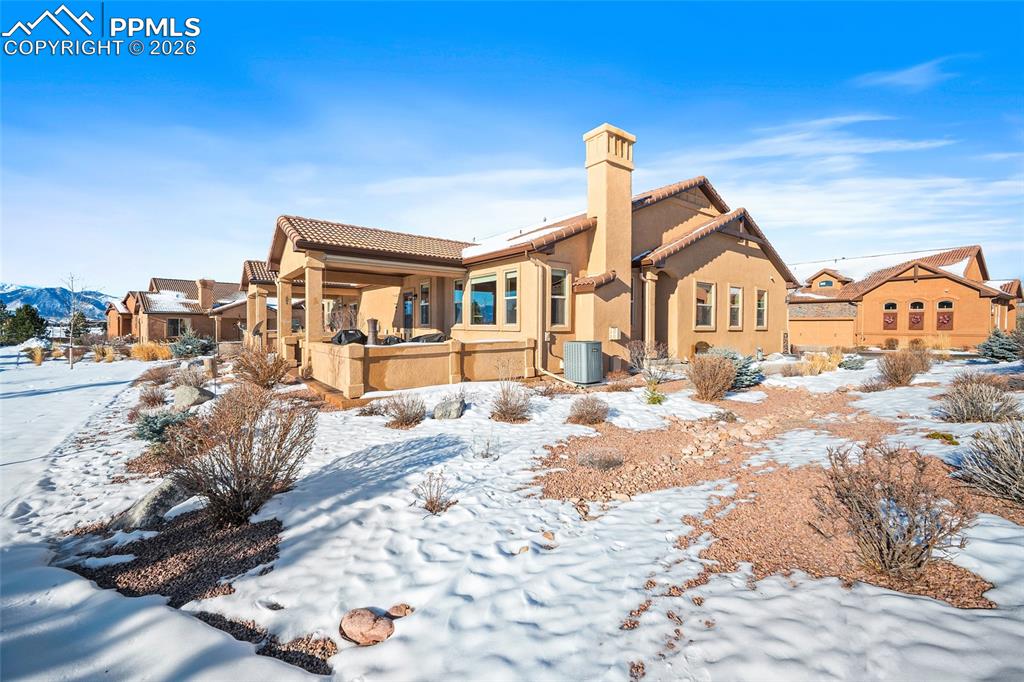 12988 Cupcake Heights Colorado Springs, CO 80921 - Photo 34 of 39 a front view of a house with a yard