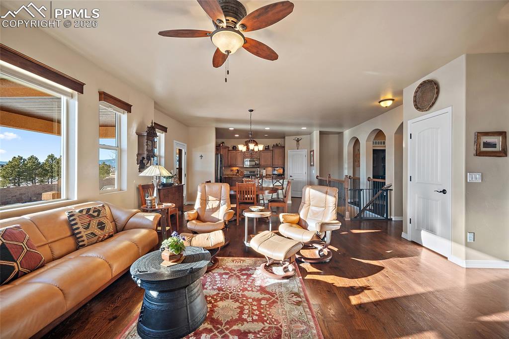 12988 Cupcake Heights Colorado Springs, CO 80921 - Photo 7 of 39 a living room with furniture or outdoor view and a large window