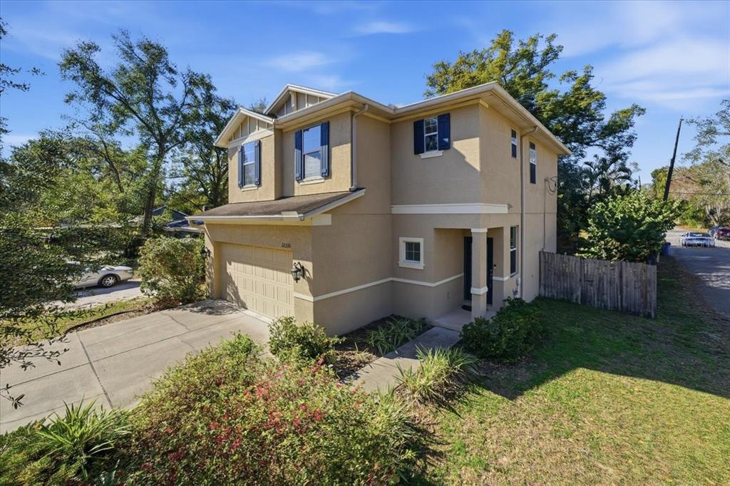 a front view of a house with garden