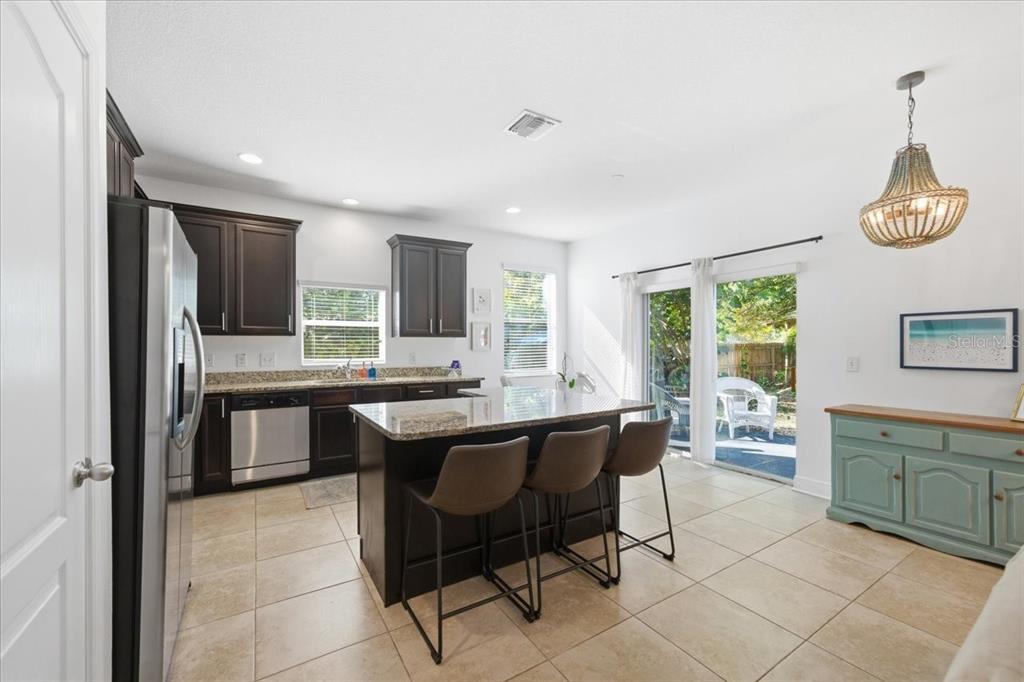 12330 North Rome Avenue Tampa, FL 33612 - Photo 13 of 33 a kitchen with a sink and chairs