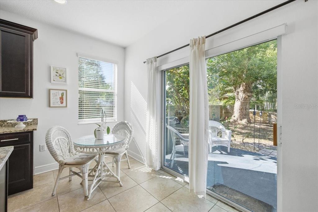 12330 North Rome Avenue Tampa, FL 33612 - Photo 16 of 33 a dining room with furniture and large windows