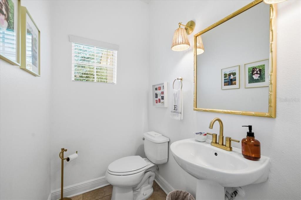 12330 North Rome Avenue Tampa, FL 33612 - Photo 17 of 33 a bathroom with a sink a toilet and mirror