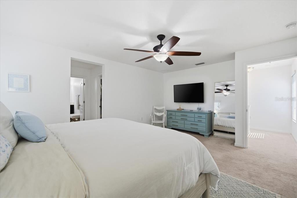 12330 North Rome Avenue Tampa, FL 33612 - Photo 19 of 33 a bedroom with a bed and a flat screen tv