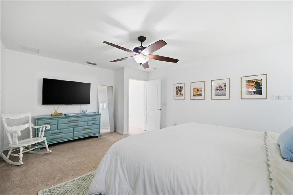 12330 North Rome Avenue Tampa, FL 33612 - Photo 20 of 33 a bedroom with a bed and a flat screen tv