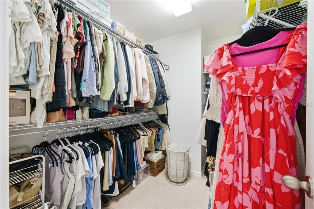 12330 North Rome Avenue Tampa, FL 33612 - Photo 23 of 33 a view of walk in closet with clothes and shoes