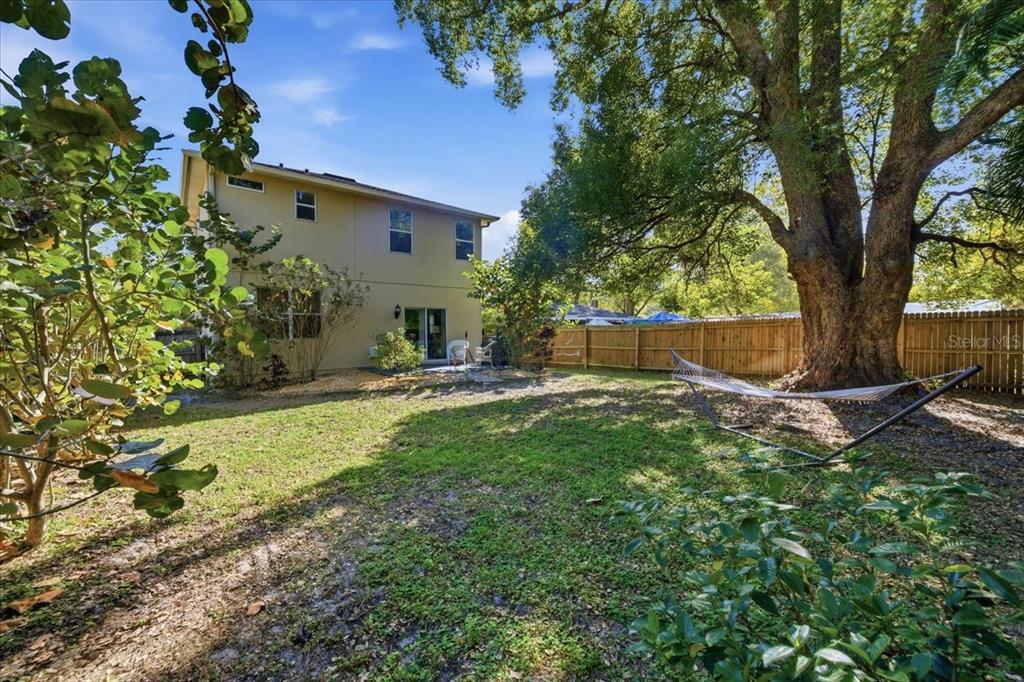 12330 North Rome Avenue Tampa, FL 33612 - Photo 32 of 33 a backyard of a house with table and chairs