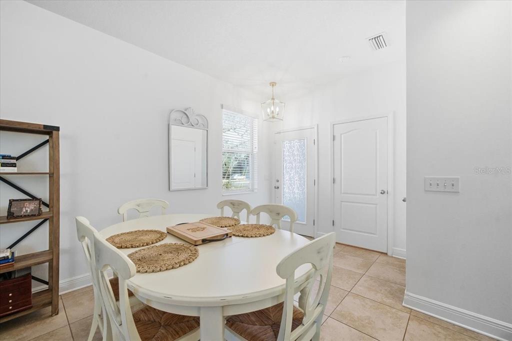 12330 North Rome Avenue Tampa, FL 33612 - Photo 9 of 33 a dining room with furniture and window