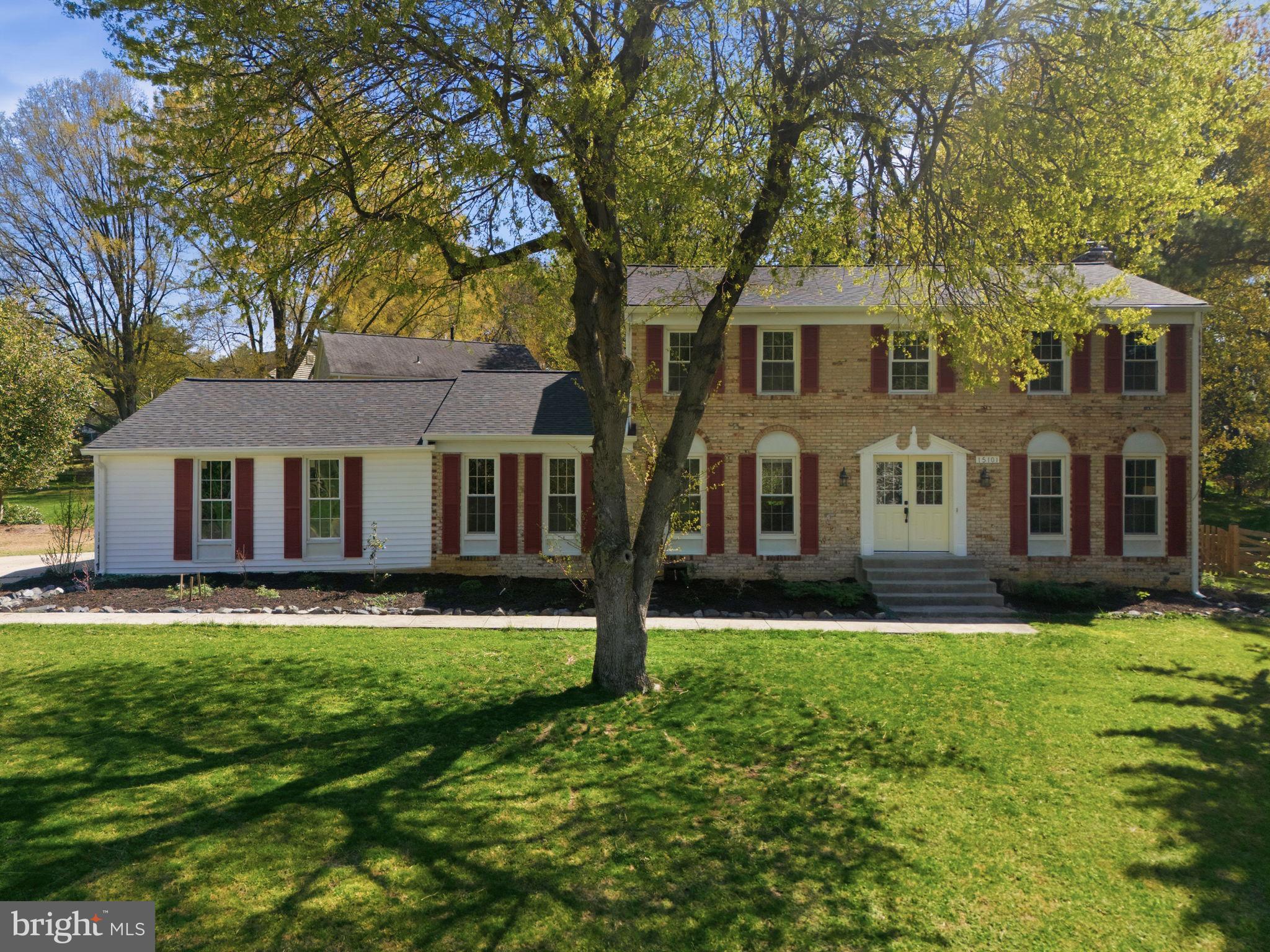 15101 Redgate Drive Silver Spring, MD 20905 - Photo 38 of 39 a front view of a house with a yard