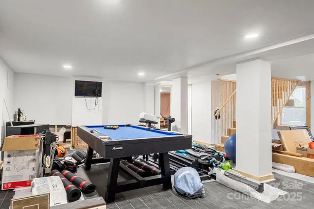 a livingroom with furniture and a flat screen tv