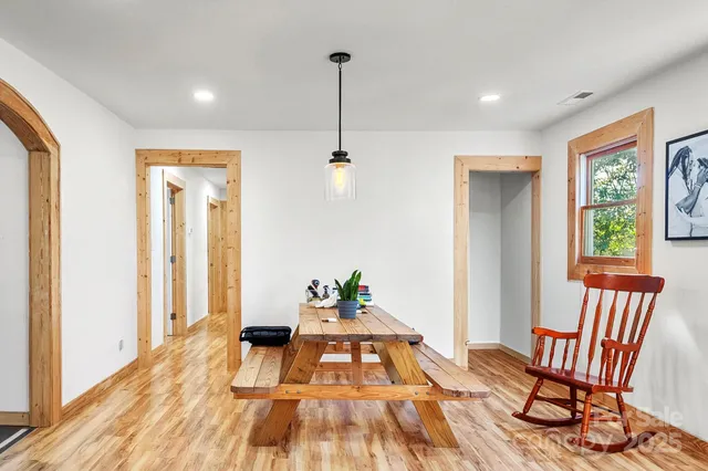 a view of a livingroom with furniture and wooden floor