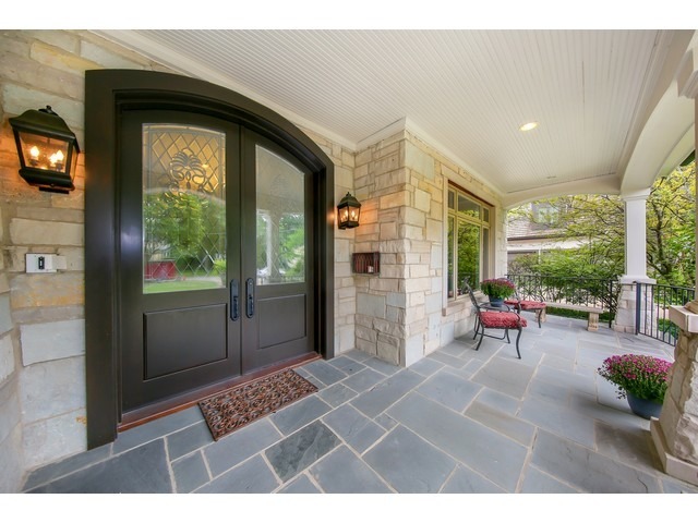 Undisclosed Address Hinsdale, IL 60521 - Photo 2 of 30 a balcony with furniture and a entrance