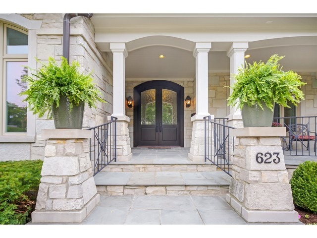 Undisclosed Address Hinsdale, IL 60521 - Photo 24 of 30 a front view of a house with a garden