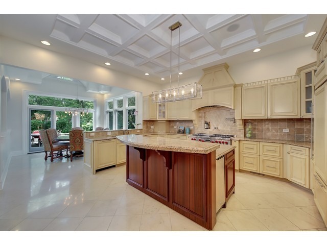 Undisclosed Address Hinsdale, IL 60521 - Photo 5 of 30 a kitchen with stainless steel appliances granite countertop a sink a stove and a refrigerator