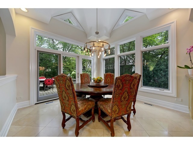 Undisclosed Address Hinsdale, IL 60521 - Photo 7 of 30 a view of a dining room with furniture wooden floor and chandelier