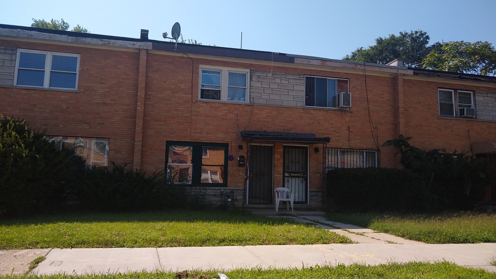 Undisclosed Address Chicago, IL 60620 - Photo 1 of 7 a view of a house with a yard
