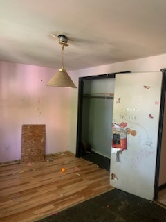 Undisclosed Address Chicago, IL 60620 - Photo 7 of 7 a room that has a rug and a chandelier