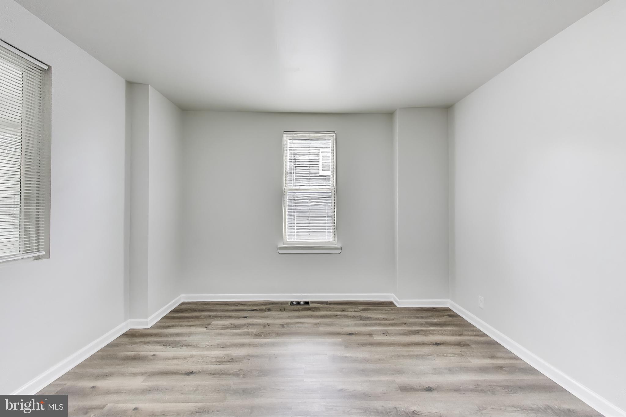 1 Maple Avenue Baltimore, MD 21206 - Photo 12 of 53 a view of empty room with wooden floor and fan