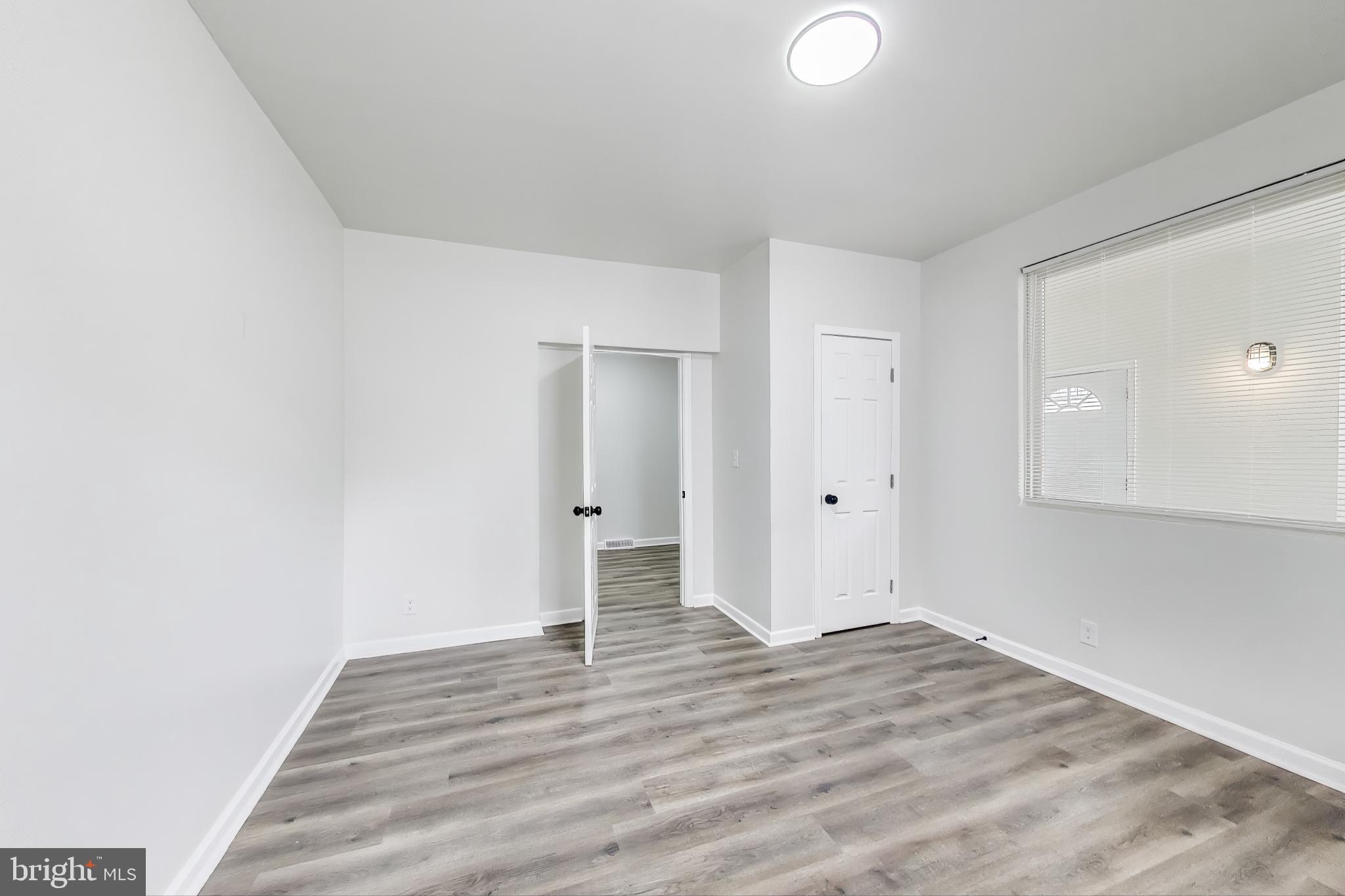 1 Maple Avenue Baltimore, MD 21206 - Photo 13 of 53 a view of an empty room with wooden floor and closet