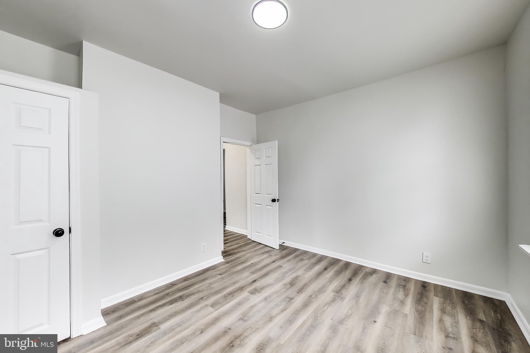 1 Maple Avenue Baltimore, MD 21206 - Photo 15 of 53 a view of a room with wooden floor