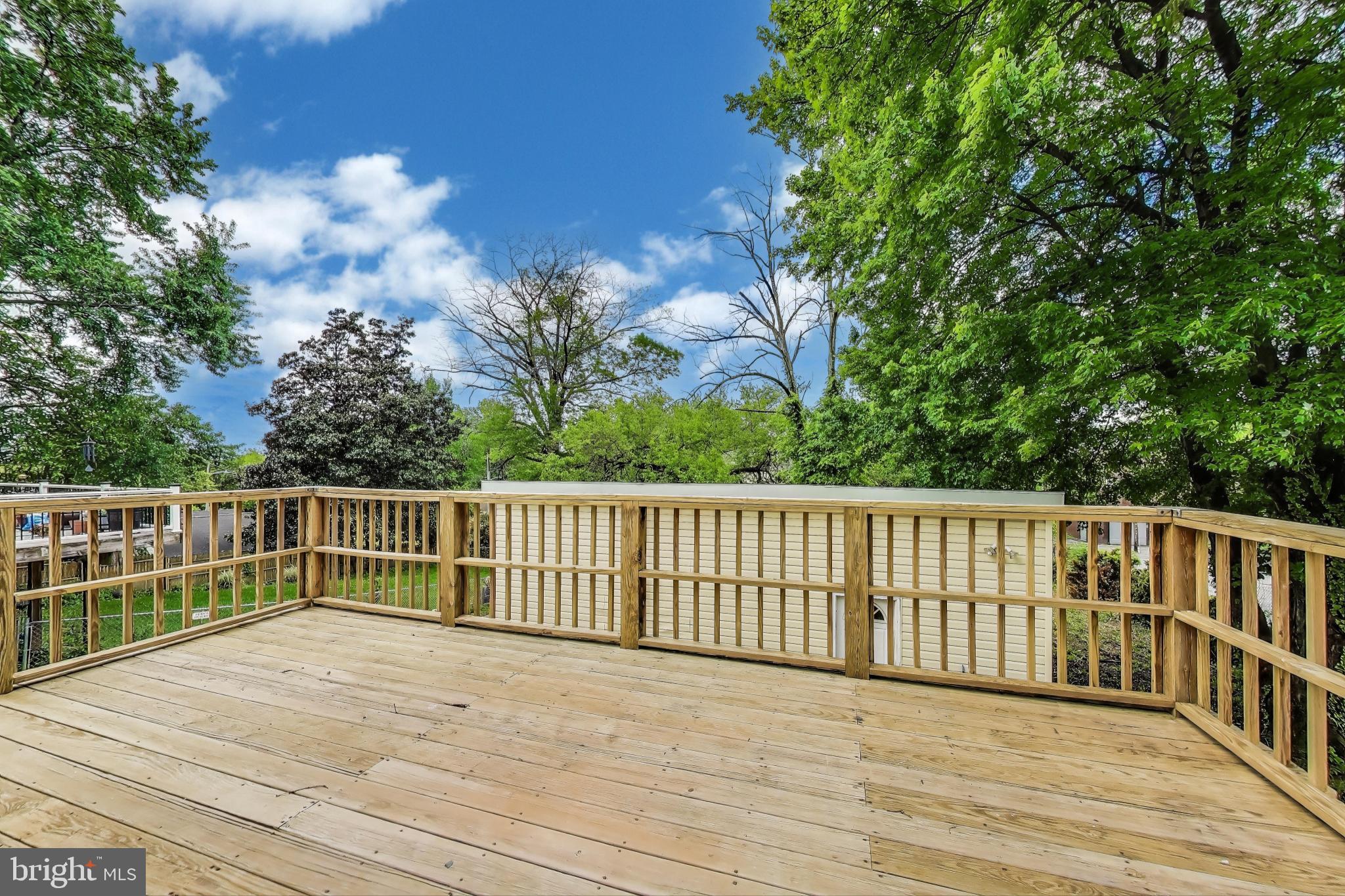 1 Maple Avenue Baltimore, MD 21206 - Photo 17 of 53 a view of balcony with wooden floor and fence