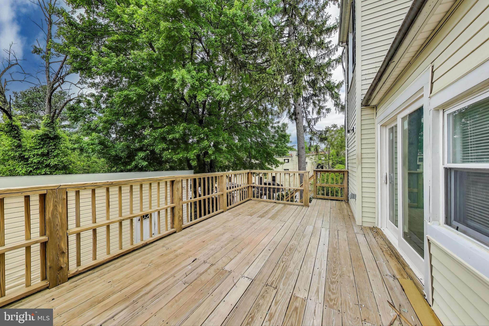 1 Maple Avenue Baltimore, MD 21206 - Photo 18 of 53 a view of balcony with wooden floor and fence