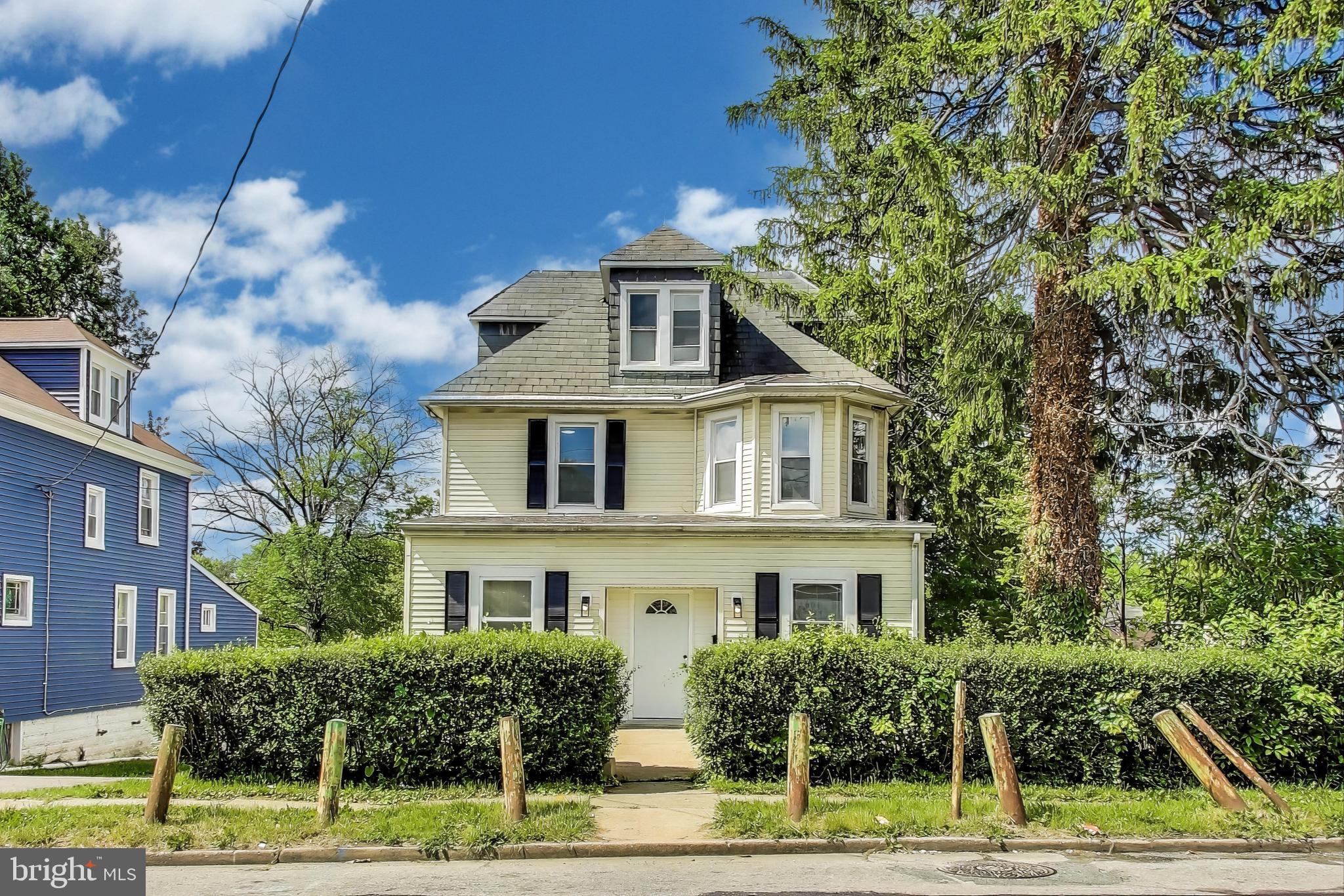 1 Maple Avenue Baltimore, MD 21206 - Photo 2 of 53 a front view of a house with a yard