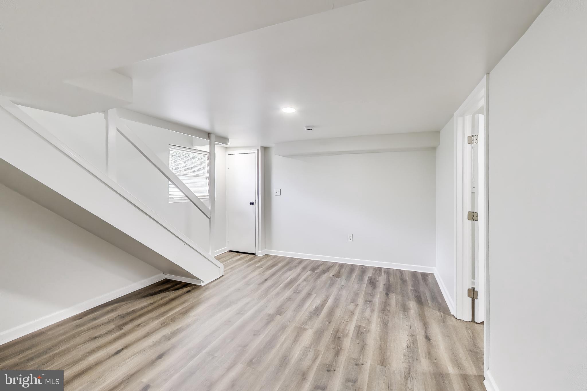 1 Maple Avenue Baltimore, MD 21206 - Photo 21 of 53 a view of an empty room with wooden floor