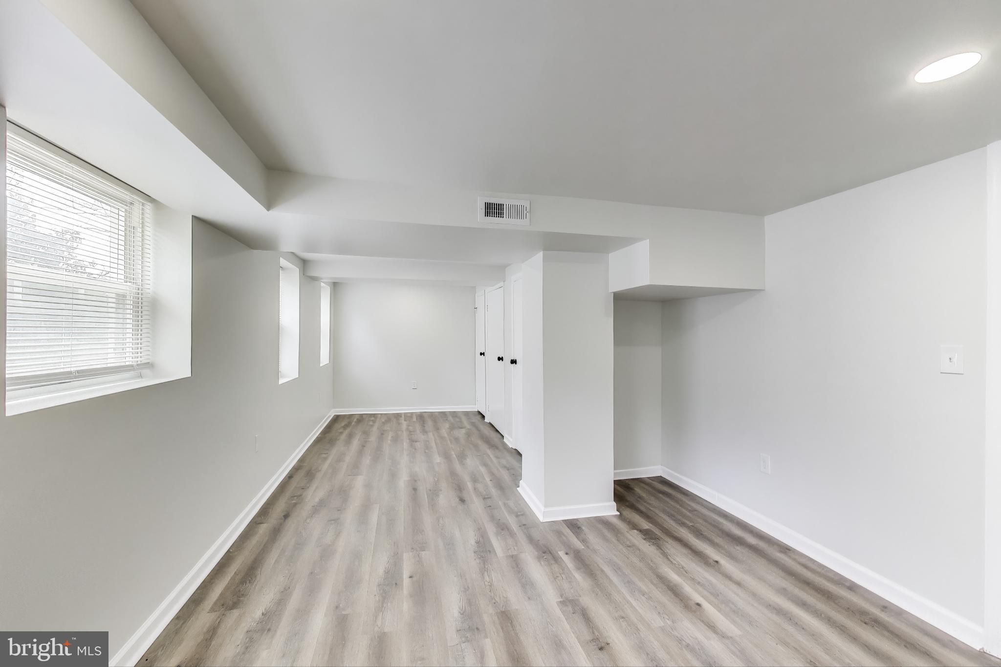 1 Maple Avenue Baltimore, MD 21206 - Photo 24 of 53 a view of wooden floor and windows in a room