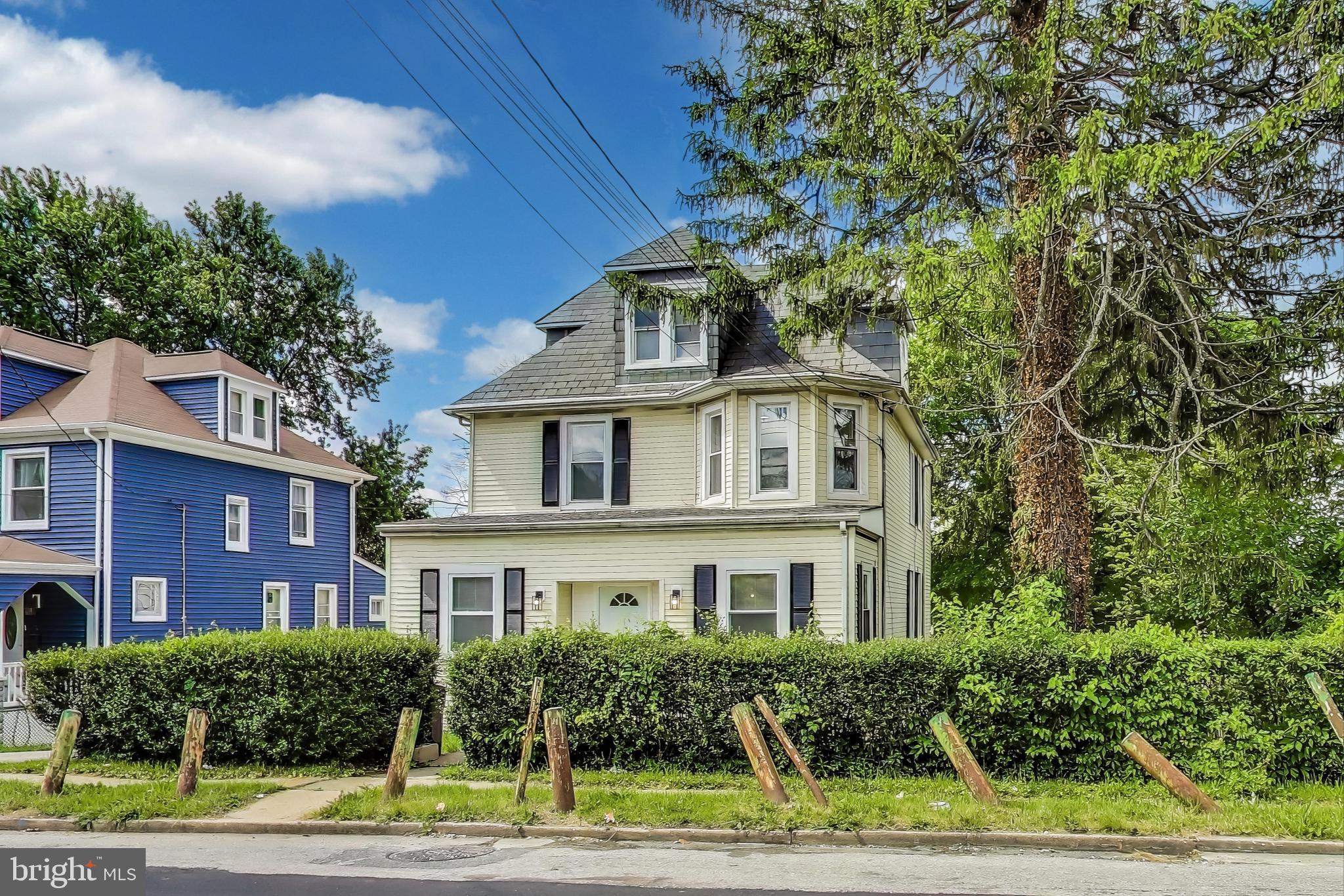 1 Maple Avenue Baltimore, MD 21206 - Photo 3 of 53 a front view of a house with a yard