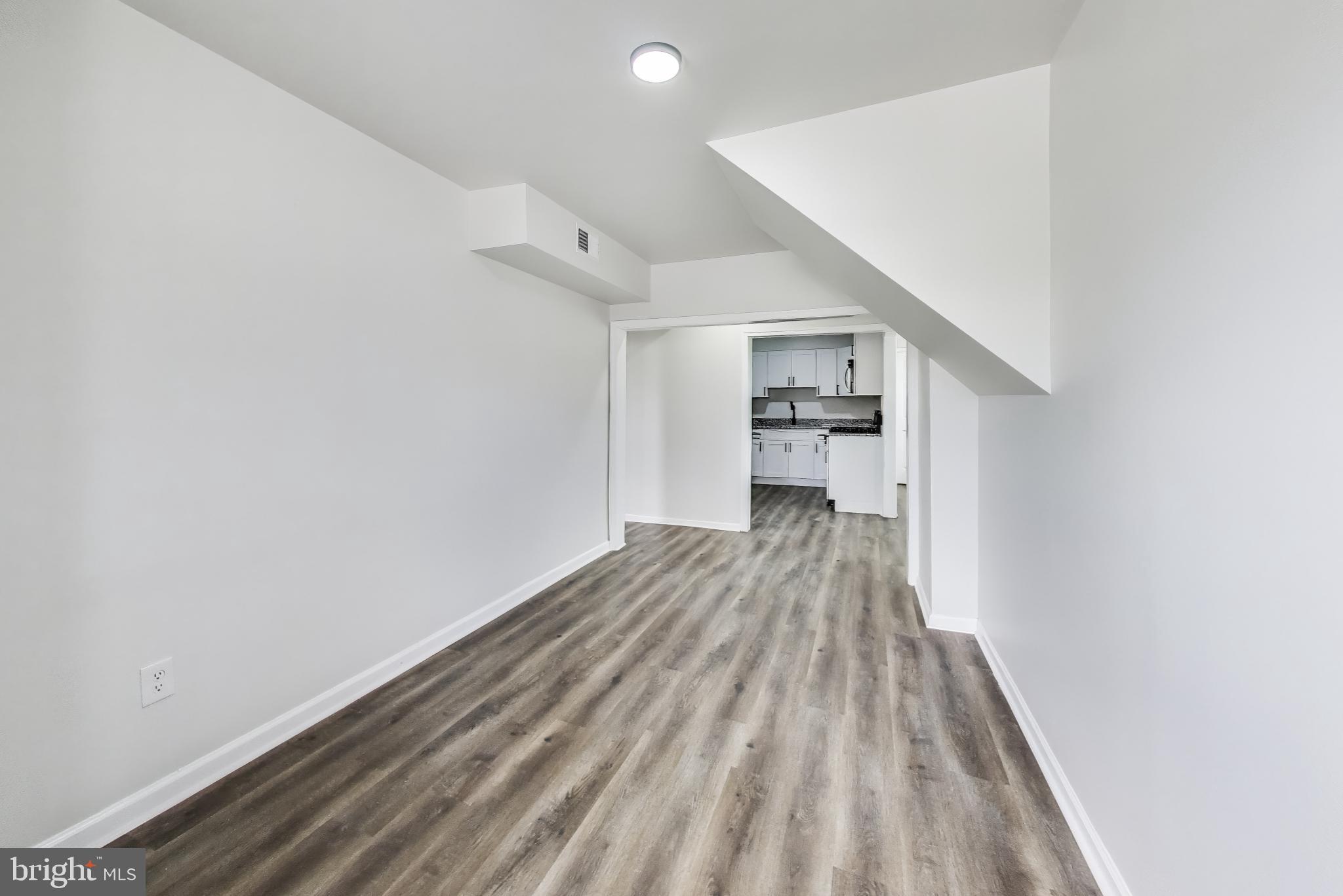1 Maple Avenue Baltimore, MD 21206 - Photo 31 of 53 a view of empty room with wooden floor