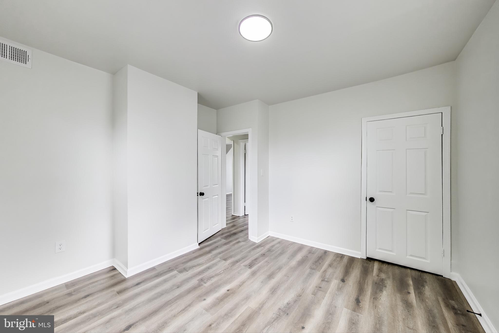 1 Maple Avenue Baltimore, MD 21206 - Photo 36 of 53 wooden floor in an empty room