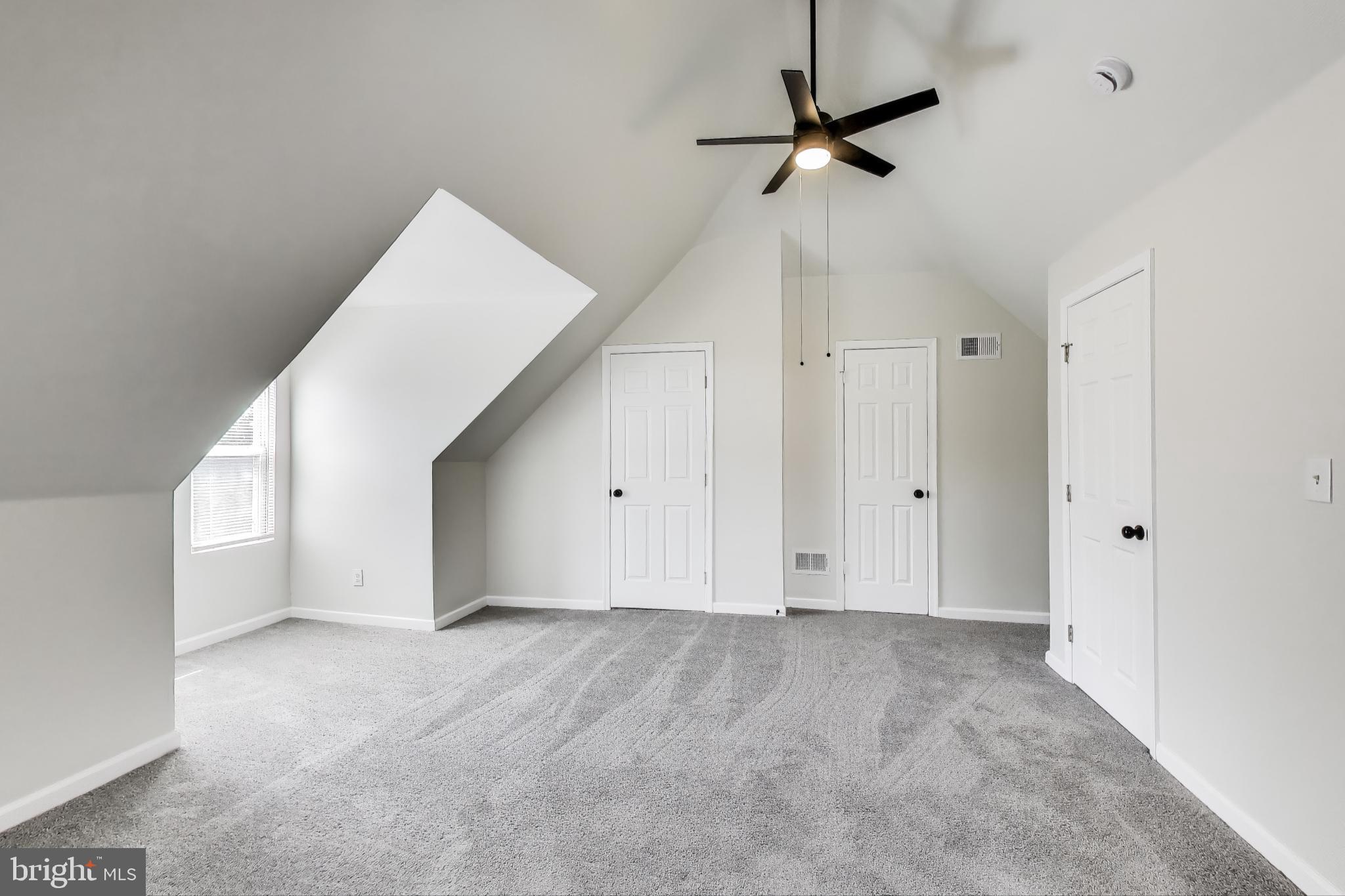 1 Maple Avenue Baltimore, MD 21206 - Photo 41 of 53 a view of an empty room with a ceiling fan